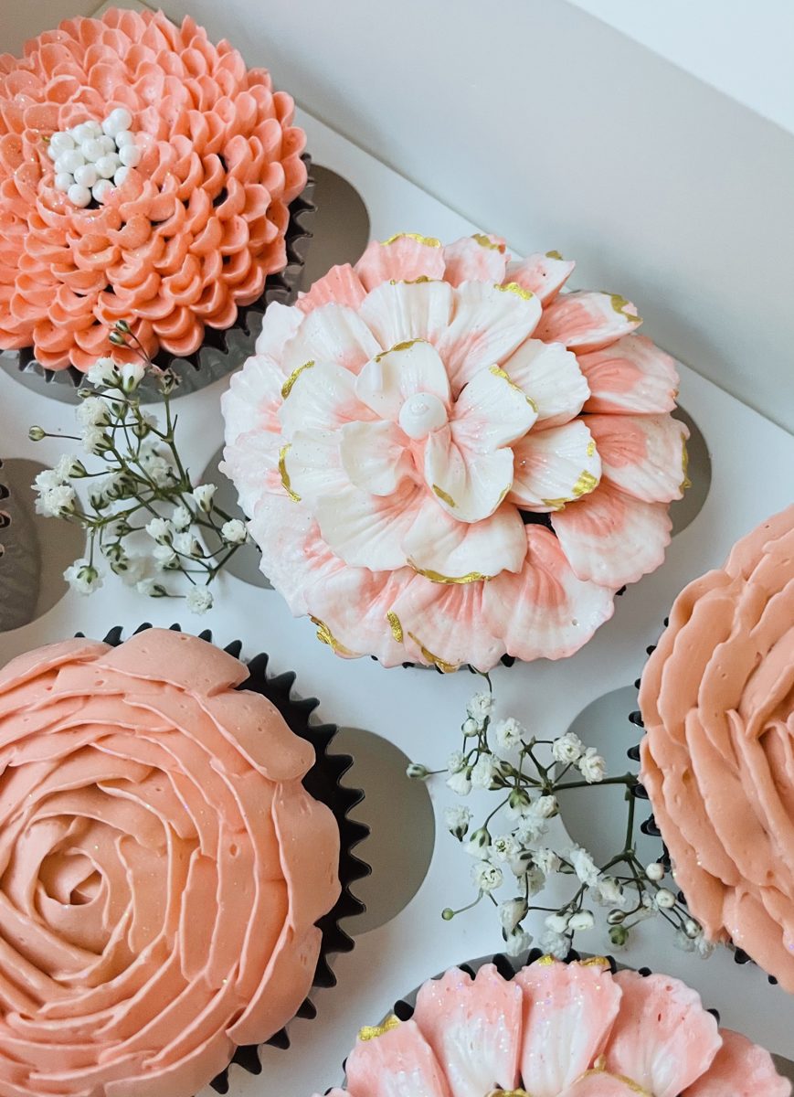 Peach buttercream dahlia cupcakes in a gift box