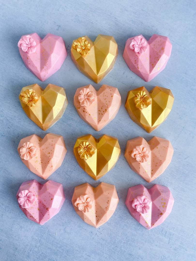 Pink and gold heart-shaped bonbons with delicate detail